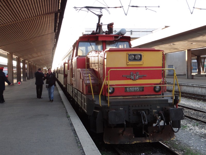 61015.4